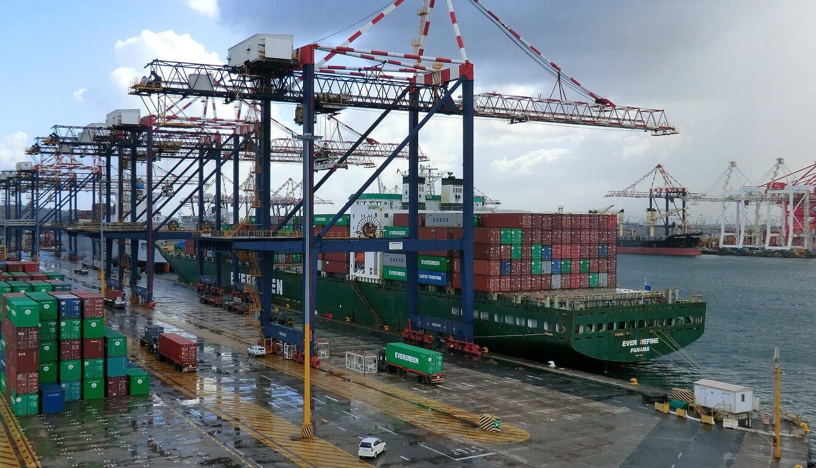 Ship-to-shore cranes loading a container vessel