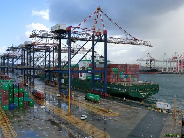 Ship-to-shore cranes loading a container vessel